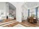 Grand foyer with staircase, wood flooring, and archways leading to the dining and living areas at 3665 S Jojoba Way, Chandler, AZ 85248