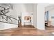 Welcoming foyer showcasing staircase, console table, and arched entryway to dining room at 3665 S Jojoba Way, Chandler, AZ 85248