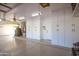 Well-organized garage with ample cabinet space and a clean epoxy floor, providing secure storage and functionality at 3665 S Jojoba Way, Chandler, AZ 85248