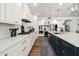 Gourmet kitchen with white cabinets, stainless steel appliances, gas cooktop, quartz countertops, and a navy island at 3665 S Jojoba Way, Chandler, AZ 85248