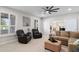 Inviting living room showcases comfortable seating and an open doorway into another room at 3665 S Jojoba Way, Chandler, AZ 85248