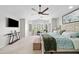 Airy bedroom features vaulted ceilings, lots of windows, a TV, and comfortable king bed at 3665 S Jojoba Way, Chandler, AZ 85248