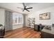 Bright office space with a fan, wood floors, desk space, and a window with shutters at 3665 S Jojoba Way, Chandler, AZ 85248