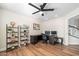 Cozy office with ample desk space, wood floors, modern shelving, and natural light at 3665 S Jojoba Way, Chandler, AZ 85248