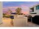 Outdoor kitchen and bar area overlooking the golf course, perfect for entertaining and enjoying the outdoors at 3665 S Jojoba Way, Chandler, AZ 85248