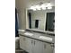 Bright bathroom with double sink vanity and a large mirror at 3677 E Park Ave, Gilbert, AZ 85234