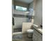 Updated bathroom featuring a glass-enclosed shower with modern tile accents at 3677 E Park Ave, Gilbert, AZ 85234