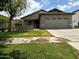 Well maintained single-story home featuring manicured lawn, attached two-car garage, and covered front porch at 3677 E Park Ave, Gilbert, AZ 85234