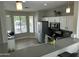 Bright kitchen with stainless steel appliances, granite countertops, a breakfast bar, and tile floors at 3677 E Park Ave, Gilbert, AZ 85234