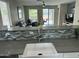 Kitchen view, with updated countertops, looking into the living room with access to the backyard pool at 3677 E Park Ave, Gilbert, AZ 85234