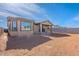 Backyard featuring a covered patio, block wall, and ample space for customization at 39980 W Bunker Dr, Maricopa, AZ 85138