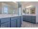 Bathroom features double sinks, large mirrors, and modern vanities at 39980 W Bunker Dr, Maricopa, AZ 85138