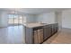 Kitchen island with stainless steel dishwasher and sink at 39980 W Bunker Dr, Maricopa, AZ 85138