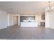 Spacious living room with ample lighting and hardwood floors at 39980 W Bunker Dr, Maricopa, AZ 85138
