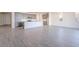 Open-concept living space featuring tile flooring and abundant natural light at 39980 W Bunker Dr, Maricopa, AZ 85138