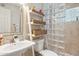 Updated bathroom featuring a glass block shower, modern sink and fixtures, and a vanity at 401 E Braeburn Dr, Phoenix, AZ 85022