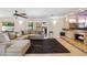 Cozy living room featuring a plush sofa and a modern fireplace at 401 E Braeburn Dr, Phoenix, AZ 85022