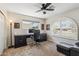 Bright home office with ample natural light, a large desk, and comfortable seating area at 401 E Braeburn Dr, Phoenix, AZ 85022