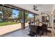 Relaxing outdoor patio with dining area overlooking the pool at 401 E Braeburn Dr, Phoenix, AZ 85022
