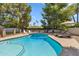 Sparkling swimming pool in a private backyard with lounge furniture at 401 E Braeburn Dr, Phoenix, AZ 85022