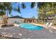 Inviting swimming pool surrounded by lounge chairs and a sun umbrella at 401 E Braeburn Dr, Phoenix, AZ 85022