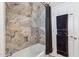 Modern shower with natural stone tile, and convenient built-in niche at 401 E Braeburn Dr, Phoenix, AZ 85022