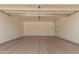 Spacious two-car garage offers ample parking and storage space for vehicles and equipment at 40329 W Thornberry Ln, Maricopa, AZ 85138