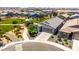 Home aerial view featuring tile roof, two-car garage, landscaping, and nearby park at 4114 S 106Th Dr, Tolleson, AZ 85353
