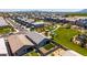 Expansive aerial view of a residential community featuring well-maintained lawns, a central park, and mountain views at 4114 S 106Th Dr, Tolleson, AZ 85353