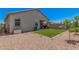 The backyard features a charming covered patio and low-maintenance landscaping at 4114 S 106Th Dr, Tolleson, AZ 85353