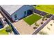 Aerial view showcasing backyard with artificial turf and mature landscaping at 4114 S 106Th Dr, Tolleson, AZ 85353