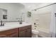 Bathroom features a double sink vanity and combined tub and shower at 4114 S 106Th Dr, Tolleson, AZ 85353