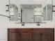 Contemporary bathroom featuring double sinks and dark brown cabinetry at 4114 S 106Th Dr, Tolleson, AZ 85353