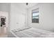Comfortable bedroom featuring a window and closet with sliding doors at 4114 S 106Th Dr, Tolleson, AZ 85353