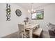 Bright dining room with rustic wooden table and stylish chandelier at 4114 S 106Th Dr, Tolleson, AZ 85353