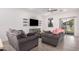 Relaxing living room with comfortable seating and sliding door access to the backyard at 4114 S 106Th Dr, Tolleson, AZ 85353