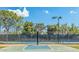 Community basketball court with lighting and tennis court in the background for outdoor fun at 4306 E Raven Rd, Phoenix, AZ 85044