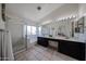 Bright bathroom offers double sinks, ample countertop space, and a separate shower and tub at 4306 E Raven Rd, Phoenix, AZ 85044