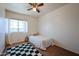 Cozy bedroom with natural light features a checkered rug and a relaxing atmosphere at 4306 E Raven Rd, Phoenix, AZ 85044