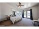 Bright and airy bedroom with mirrored closet, ceiling fan, and access to a private balcony at 4306 E Raven Rd, Phoenix, AZ 85044
