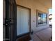 Inviting entryway with a secure screen door, Hello mat and window allowing natural light at 4306 E Raven Rd, Phoenix, AZ 85044