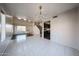 Bright living room with hardwood and tile floors and a view of the kitchen at 4306 E Raven Rd, Phoenix, AZ 85044