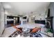 Open concept living area with hardwood floors, fireplace and a view of the kitchen at 4306 E Raven Rd, Phoenix, AZ 85044