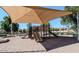 Community playground featuring slides, climbing equipment, and shade structures for outdoor fun at 4306 E Raven Rd, Phoenix, AZ 85044