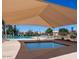 Community pool and spa with shaded seating areas offer a relaxing outdoor experience at 4306 E Raven Rd, Phoenix, AZ 85044