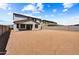 Large, unfurnished backyard with a block fence, perfect for outdoor activities and entertainment at 5881 N 193Rd Dr, Litchfield Park, AZ 85340