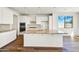 Modern kitchen featuring an island, quartz countertops, and stainless steel appliances at 5881 N 193Rd Dr, Litchfield Park, AZ 85340