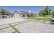 Beautiful backyard with pool, basketball court, and concrete tile design at 625 E Silver Creek Rd, Gilbert, AZ 85296
