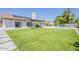 Backyard features a pool, artificial grass, tile roof, and a covered patio at 625 E Silver Creek Rd, Gilbert, AZ 85296