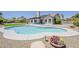 Spacious backyard with a pool, low maintenance landscaping, and a covered patio, perfect for outdoor entertaining at 625 E Silver Creek Rd, Gilbert, AZ 85296